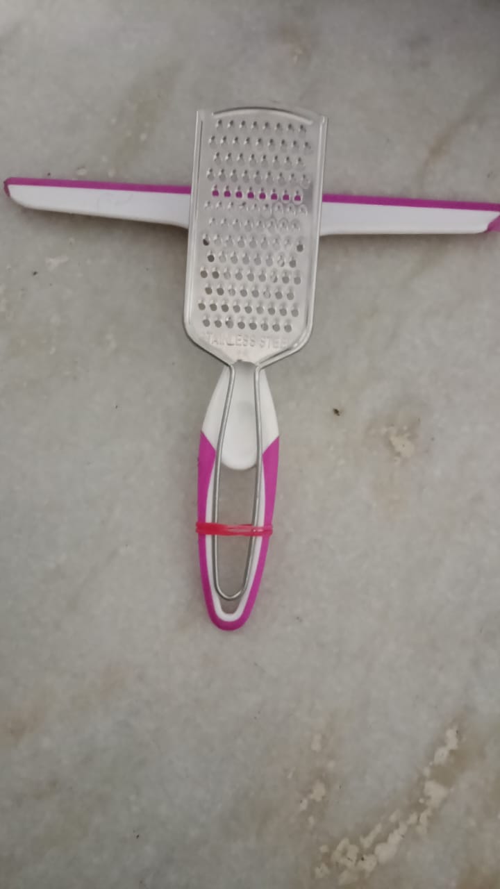 A Mini Glass & Countertop Rubber Squeegee Wiper (pink and white handle). 99rs